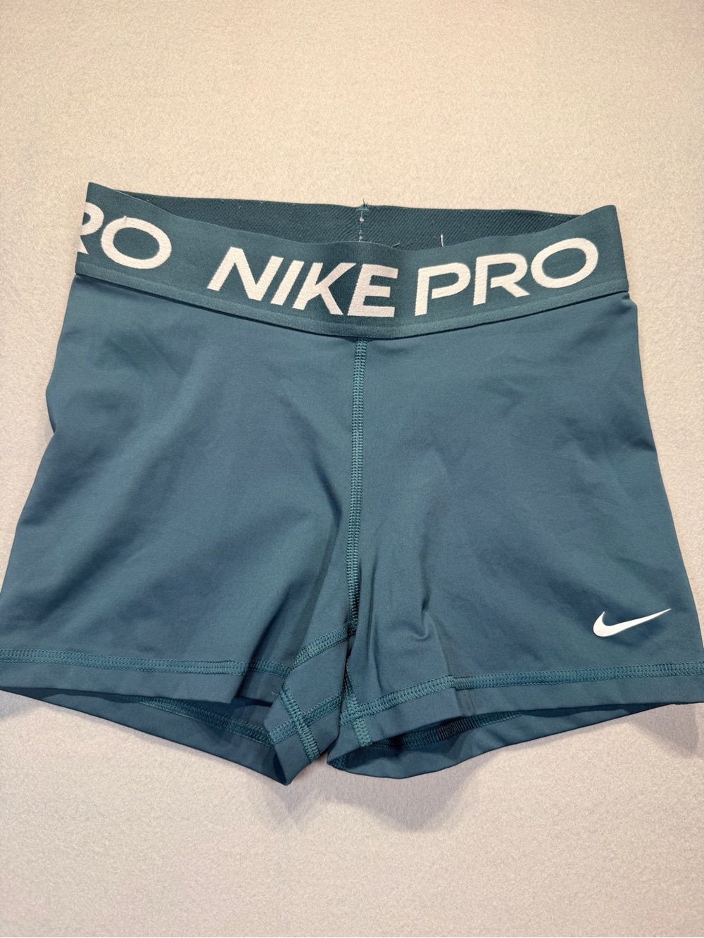 Nike Pro Women's Teal Athletic Shorts with White Logo